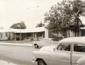 Cars in front of a building.