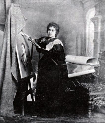 image of a woman in front of a canvas on an easel