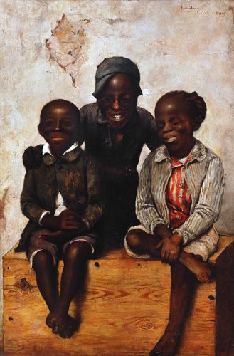 Three children sitting on a wooden chest.