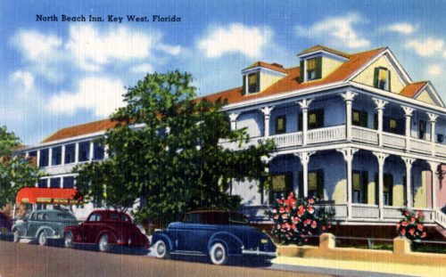 Postcard of a building with cars parked out front and text North Beach Inn, Key West, Florida.