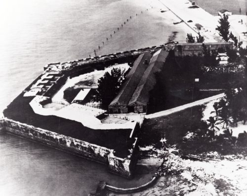 Aerial view of a three-sided fort portruding into the water.