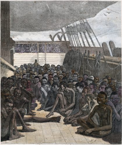 Engraving of a group of enslaved people sitting on the deck of a ship.