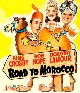 Bing Crosby, Bob Hope, Dorothy Lamour, Road to Morocco. Cartoon of a camel with two men and a woman riding on it.