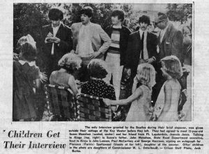 five men stand in front of a group of girls and women. Caption reads Children Get Their interview. The only interview granted by the Beatles during their brief stopover was given outside their cottage at the Key Wester before they left. They had agreed to meet 12-year-old Suzen Monahan (seated, center) and her from Fort Lauderdale, Jeannie Jones. Talking to Ringo (top, right) is Sezen's father, John Monahan, state road executive. Nex tto Ringo is John Lennon, paul McCartney and George Harrison, signing an autograph for Florence (Farnie) Spottswood (blonde at far left), daughter of the senator. Other children in the photo are daughters of Commissioner W.L. osterhoudt. Citizen staff photo, Jack Burke.