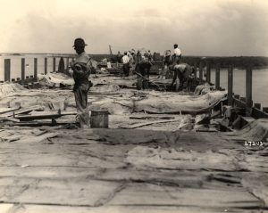 A crew working on a bridge under construction.