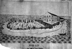 A small island with a building and cemetery on it. Text at the bottom reads Sand Key Northwest of Fort Jefferson coast of Florida.