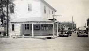 A buildign with an awning and lettering that reads Key West Art Center Public Exhibition.